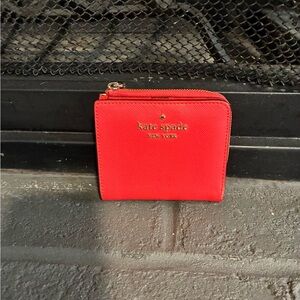 kate spade red compact wallet with gold logo
